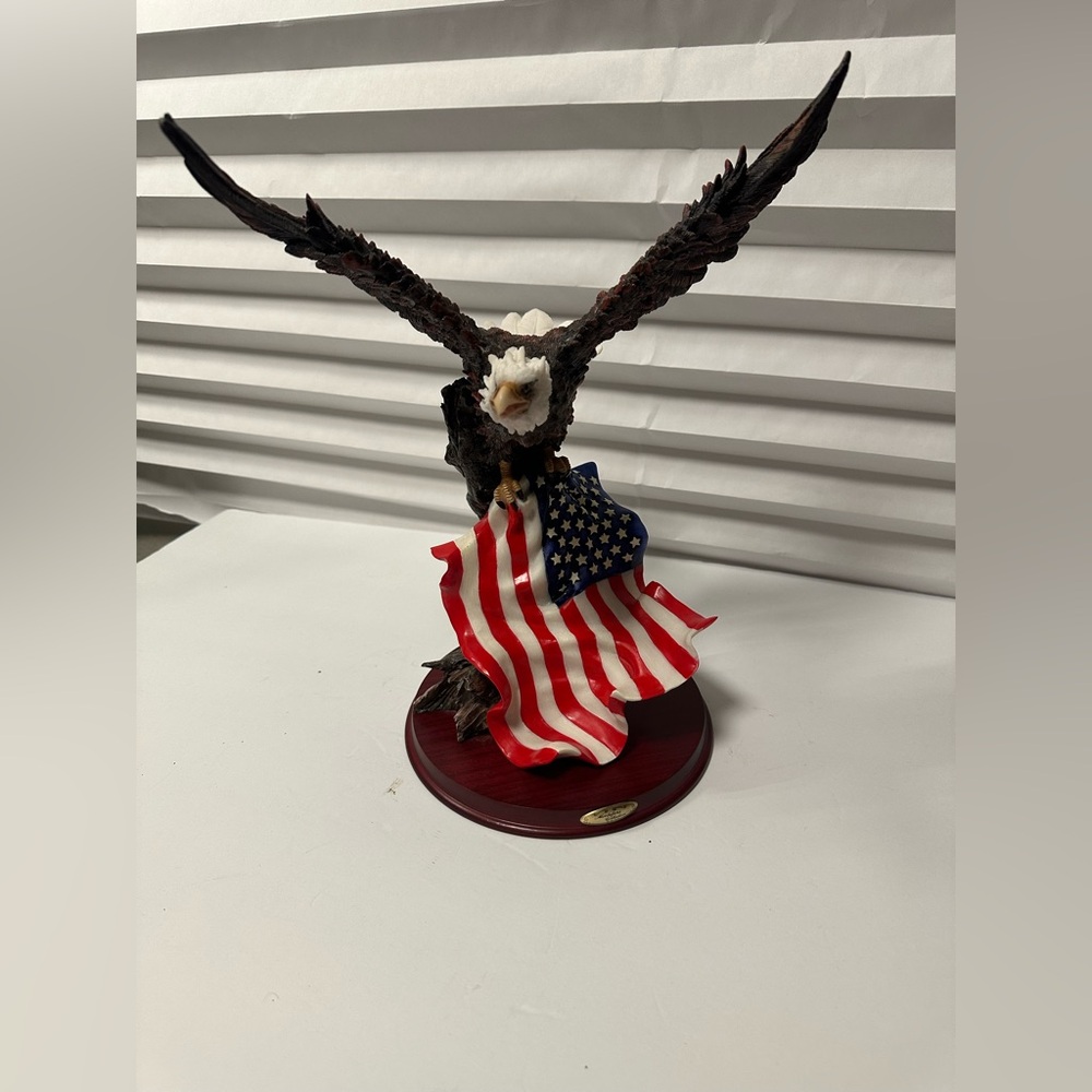 Montefiori Collection Eagle Holding American Flag On A Tree Sculpture".